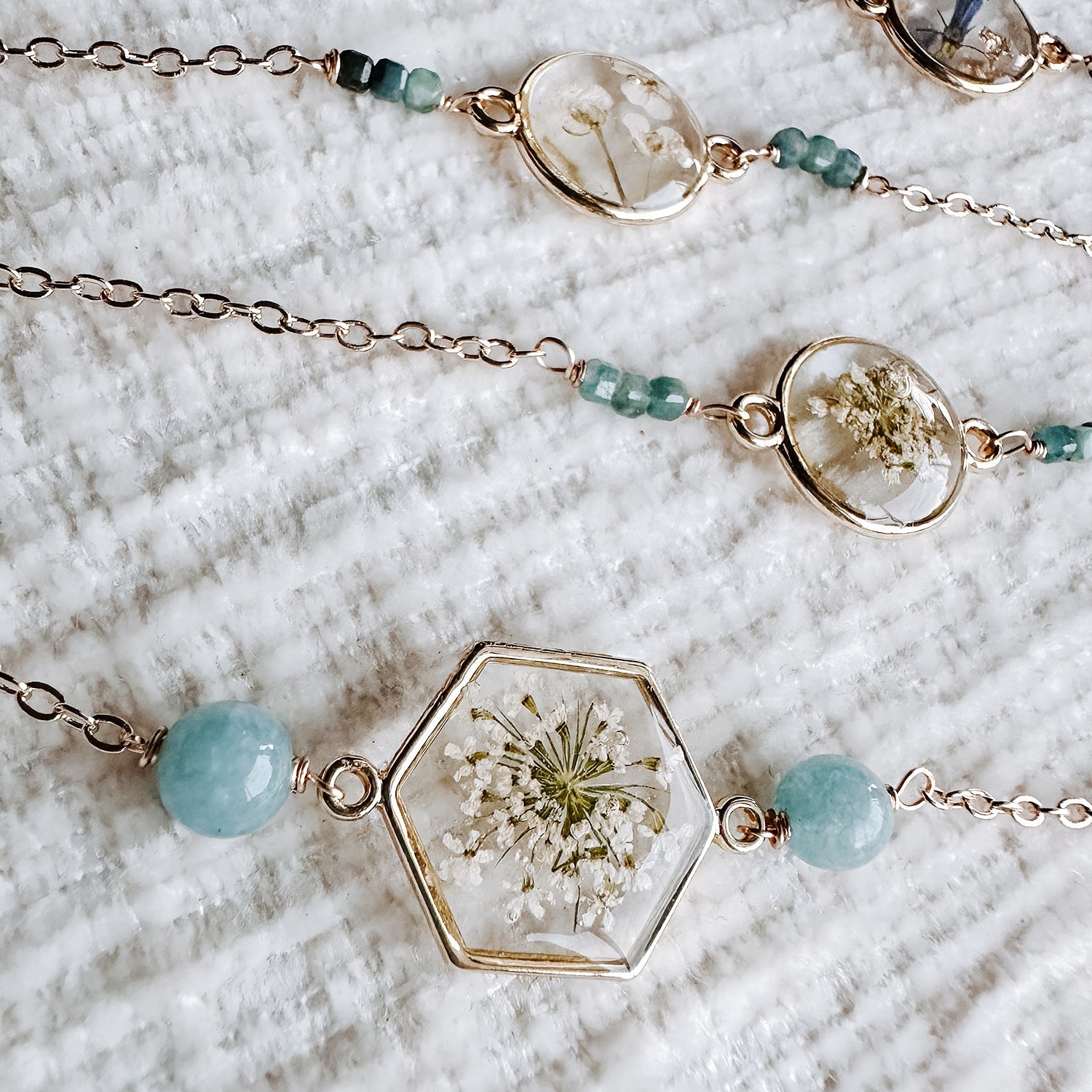 Delicate bracelets featuring flowers, pearls, and resin — kolour me australia